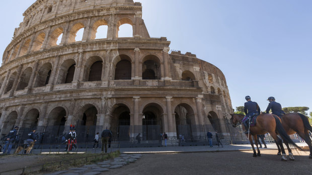 Police patrol outside the Colosseum in Rome.