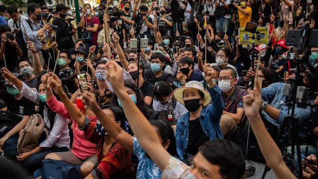 Protesters wave chopsticks as makeshift wands during a Harry Potter-themed rally in Bangkok on August 3.