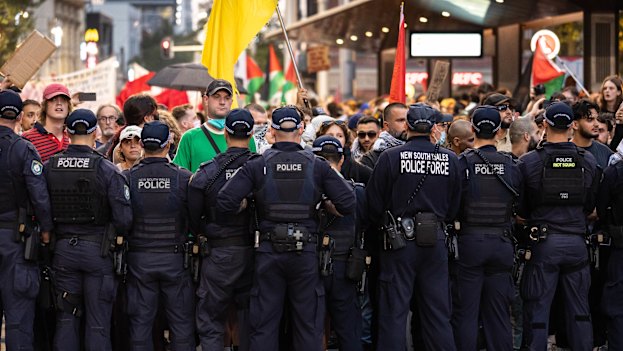 Palestine Action Group members and supporters hold a protest and eventually clash with police near Town Hall during the Israeli president’s visit to Sydney.