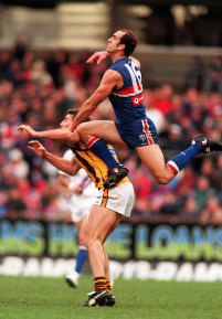 Croft senior goes up against Hawk Nick Holland in 1999.