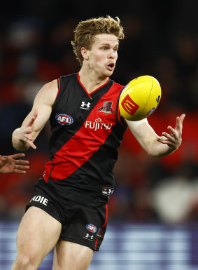 Essendon midfielder Ben Hobbs’ pre-season is on hold due to a calf strain.