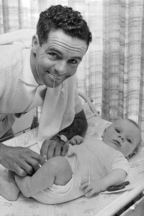 Jockey Ray Selkrig changing the baby's nappy. September 22, 1967.