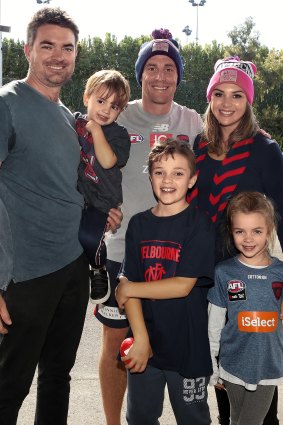 Amber Whalan and her family with Melbourne coach Simon Goodwin.