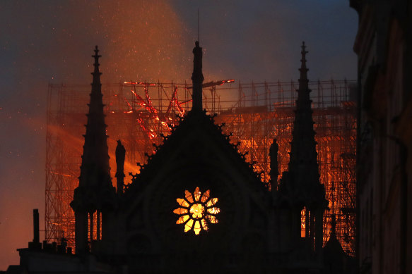 Flames and smoke rise from Notre-Dame Cathedral as it burns in Paris April 15, 2019. 