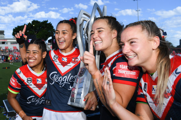 Roosters Simone Karpani,  Corban Baxter, Isabelle Kelly and Brydie Parker celebrate their NRLW title earlier this year.