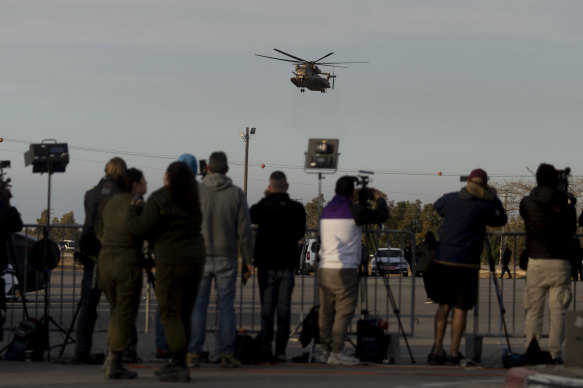 An Israeli helicopter believed to be involved in the transfer of hostages is pictured near Re’im, near the Gaza border.