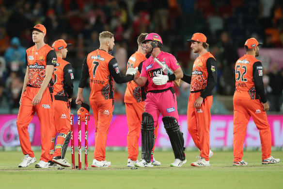 Sydney Sixers star Dan Christian shakes hands with Liam Livingstone of the Scorchers, who are wearing their Indigneous strip.