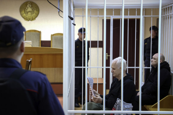 Human rights activist Ales Bialiatski sits in the defendant’s cage.