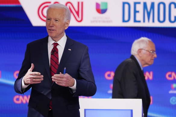 Former vice-president Joe Biden and Bernie Sanders at the debate in Washington.