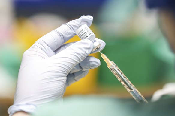 The Pfizer vaccine is prepared for use by pharmacy-trained nurses at the COVID-19 Surge Centre in Canberra.