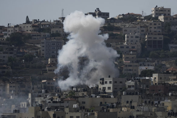 Smoke rises during an Israeli military raid of the militant stronghold of Jenin in the occupied West Bank, on Monday.