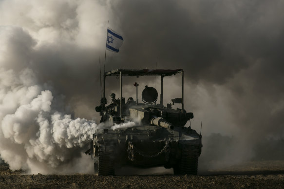 An Israeli tank moves along the border with the Gaza Strip in southern Israel.
