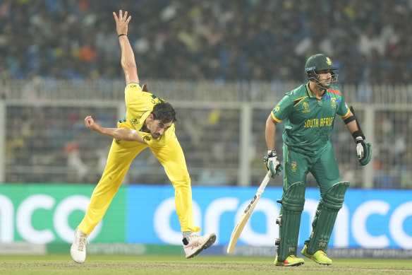 Australia’s Mitchell Starc slams a delivery into the seething Eden Gardens pitch against South Africa.