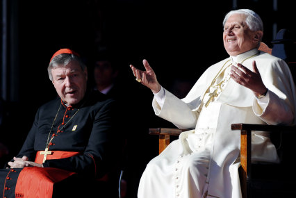 Pope Benedict XVI, right, gestures as he sits with Cardinal George Pell, 2008.