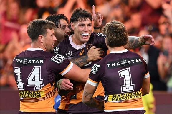 Jordan Riki celebrates with teammates after scoring a try during the preliminary final.