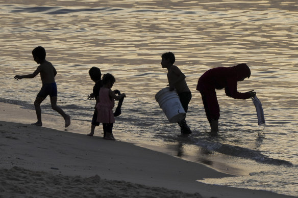 Palestinians visit the beach in Deir al Balah, Gaza Strip, on the second day of a cease-fire between Israel and Hamas.