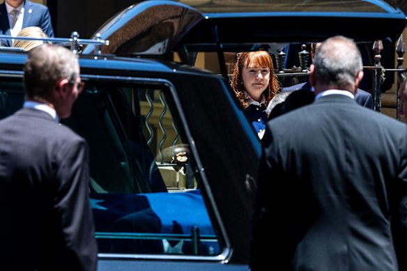 Richardson’s wife Amanda watches the coffin depart.
