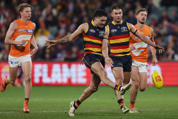 Crow on the fly: Izak Rankine kicks clear.