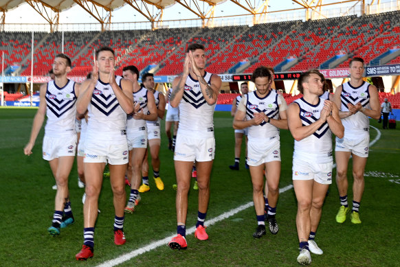 No contest: The Dockers celebrate a 64-point win over North Melbourne. 
