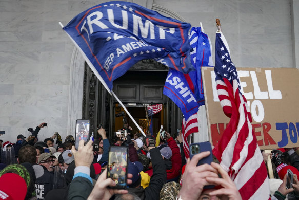 Rioters break into the Capitol in Washington on January 6, 2021. 