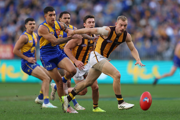 James Worpel of the Hawks is pursued by Eagles players. 