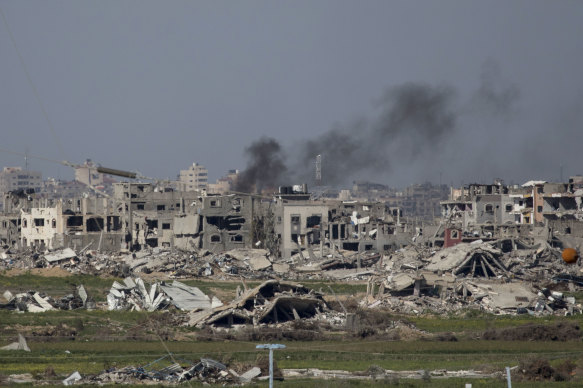 Smoke rises over Gaza as seen from a position on the Israeli side of the border in Southern Israel, Israel. 