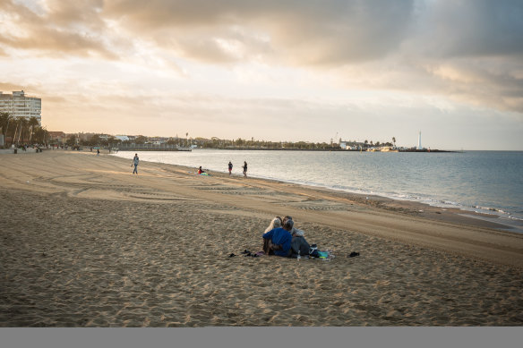 The sun rises over St Kilda beach on New Year's Day.