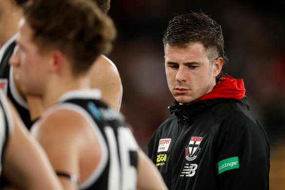 Jack Higgins on the sidelines after suffering from a concussion during 2022.