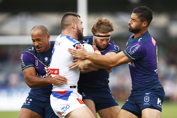 David Klemmer is tackled by Felise Kaufusi, Christian Welch and Jesse Bromwich.