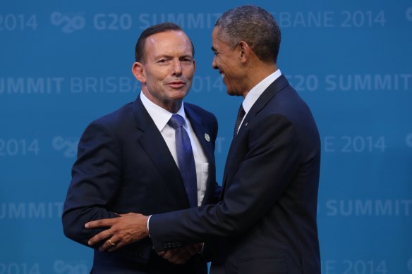 Getting a grip: Tony Abbott, then Prime Minister, welcomes US President Barack Obama to the G20 in Brisbane in 2014.
