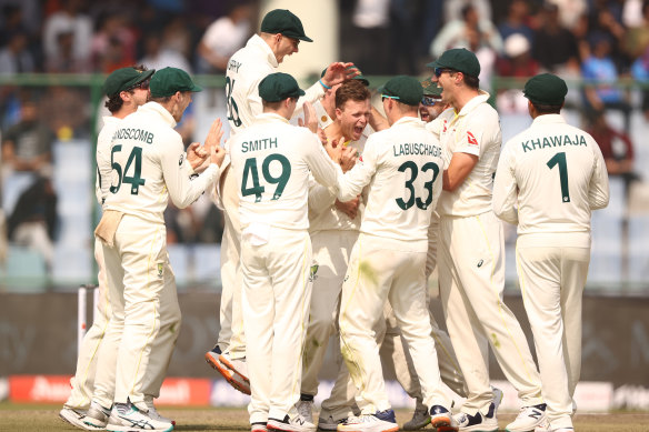 Todd Murphy leaps with joy after Matt Kuhnemann claims Virat Kohli for a maiden Test wicket.