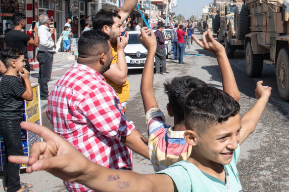 Turkish tanks escort the Free Syrian Army into Syria on October 10. 