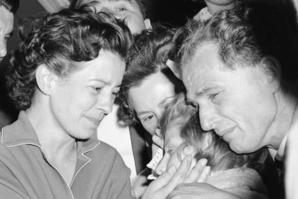 Livia Wald, centre front, is reunited with her mother, Anna, left, and father Arpad, right, at Melbourne Airport on Christmas Eve, 1962. 