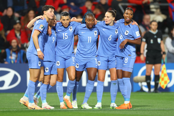 The French celebrate Kadadiatou Diani’s first goal.