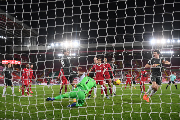 Liverpool goalkeeper Alisson pulls off a sensational save to deny Manchester United talisman Marcus Rashford.