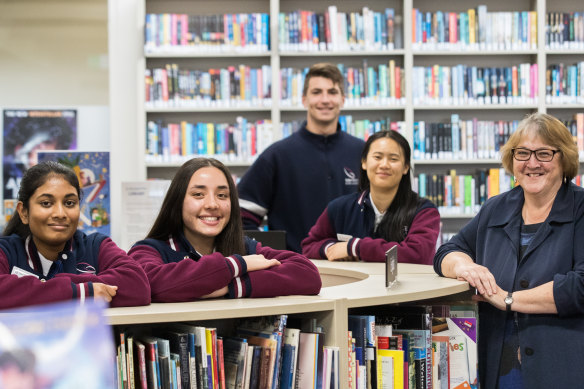 Keilor Downs College principal Linda Maxwell with some of her students, who thrived despite COVID disruptions.  Keilor Downs was named a Schools that Excel winner among western Melbourne government schools.