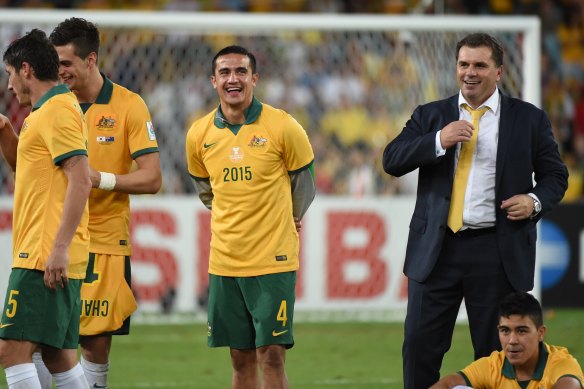 Cahill and Ange Postecoglou celebrate the Socceroos’ Asian Cup triumph in 2015.