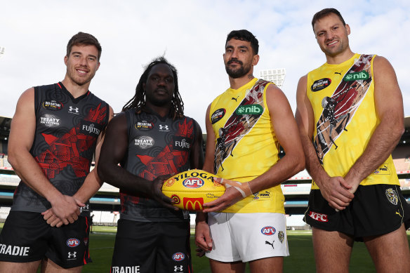 Zach Merrett and Anthony McDonald-Tipungwuti of the Bombers and Marlion Pickett and Toby Nankervis of the Tigers ahead of the Dreamtime at the ’G Game.