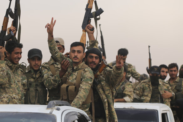 Turkish-backed Free Syria Army fighters on the Turkey-Syria border. 