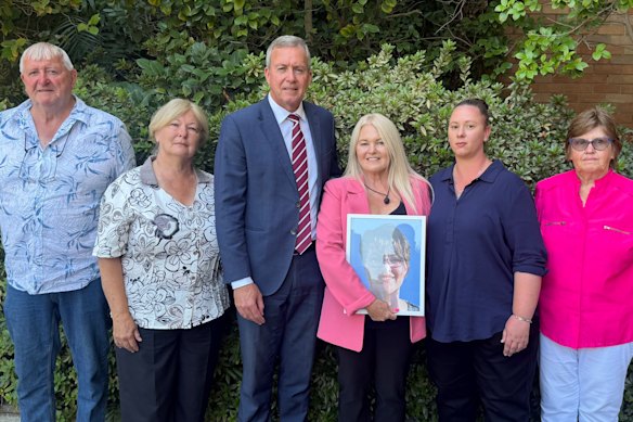 WA Police Minister Reece Whitby with the family of Kelly T’Hart on Monday.
