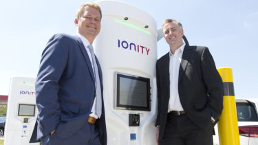 Dr Michael Hajesch, chief executive of IONITY and Dr David Finn, chief executive and co-founder of Tritium with a charging station in Germany. 
