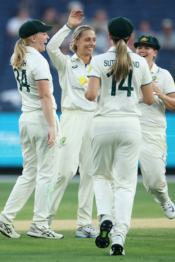 Ash Gardner of Australia celebrates the dismissal of Lauren Filer of England.