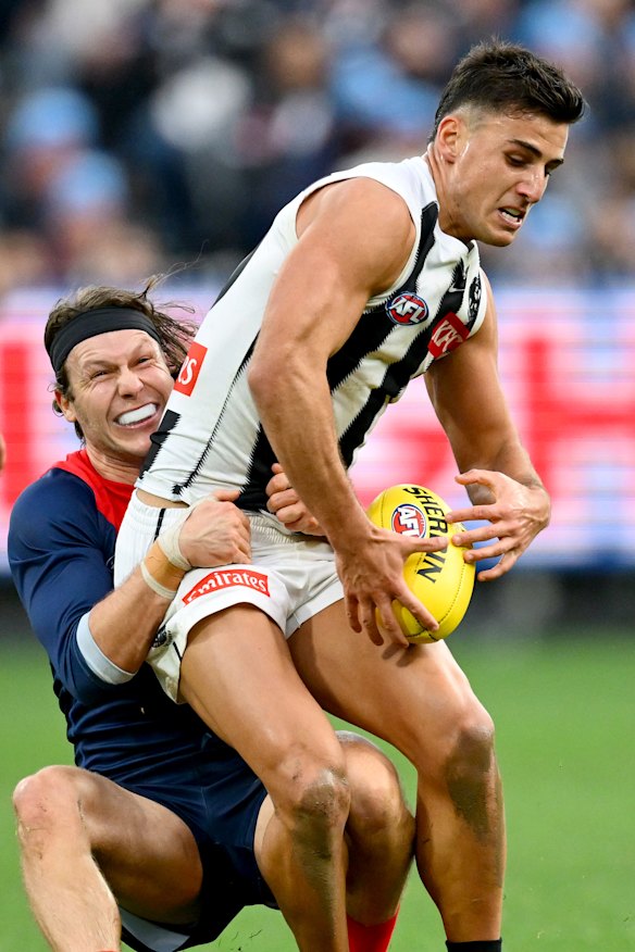 Melbourne’s Ed Langdon kept a tight grip on Nick Daicos.
