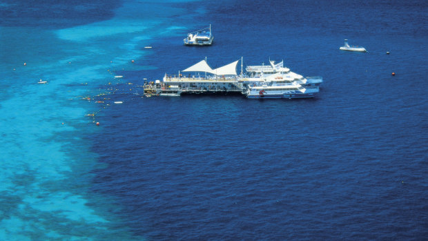 The helicopter crashed near a tourist pontoon at Hardy's Reef in the Whitsundays.