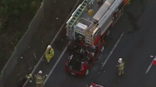 A car ran into the back of a fire truck parked at an accident on the M1 at Rochedale South.