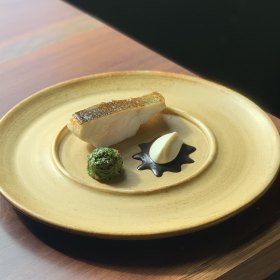 Murray cod with macadamia and mustard greens.