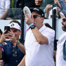 A fan has a shoey at the watering hole during LIV Golf Adelaide.