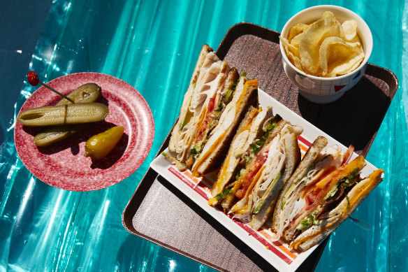 Garlic-buttered bread sends the flavour of this club sandwich soaring.