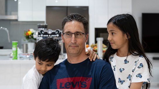 Kurt Bridde, 44, with his children Izabelle, 10, and Levi, 7, in their Casula home.