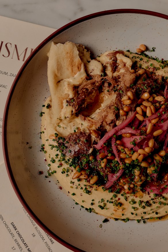 Lamb hummus with pine nuts and sumac.